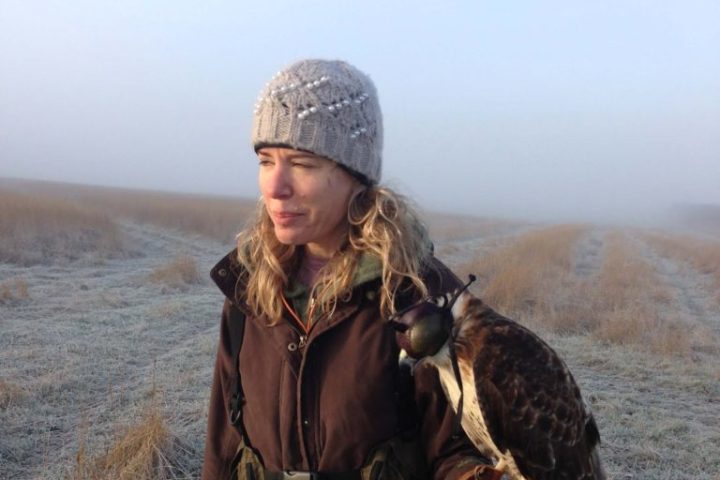 a person holding a bird